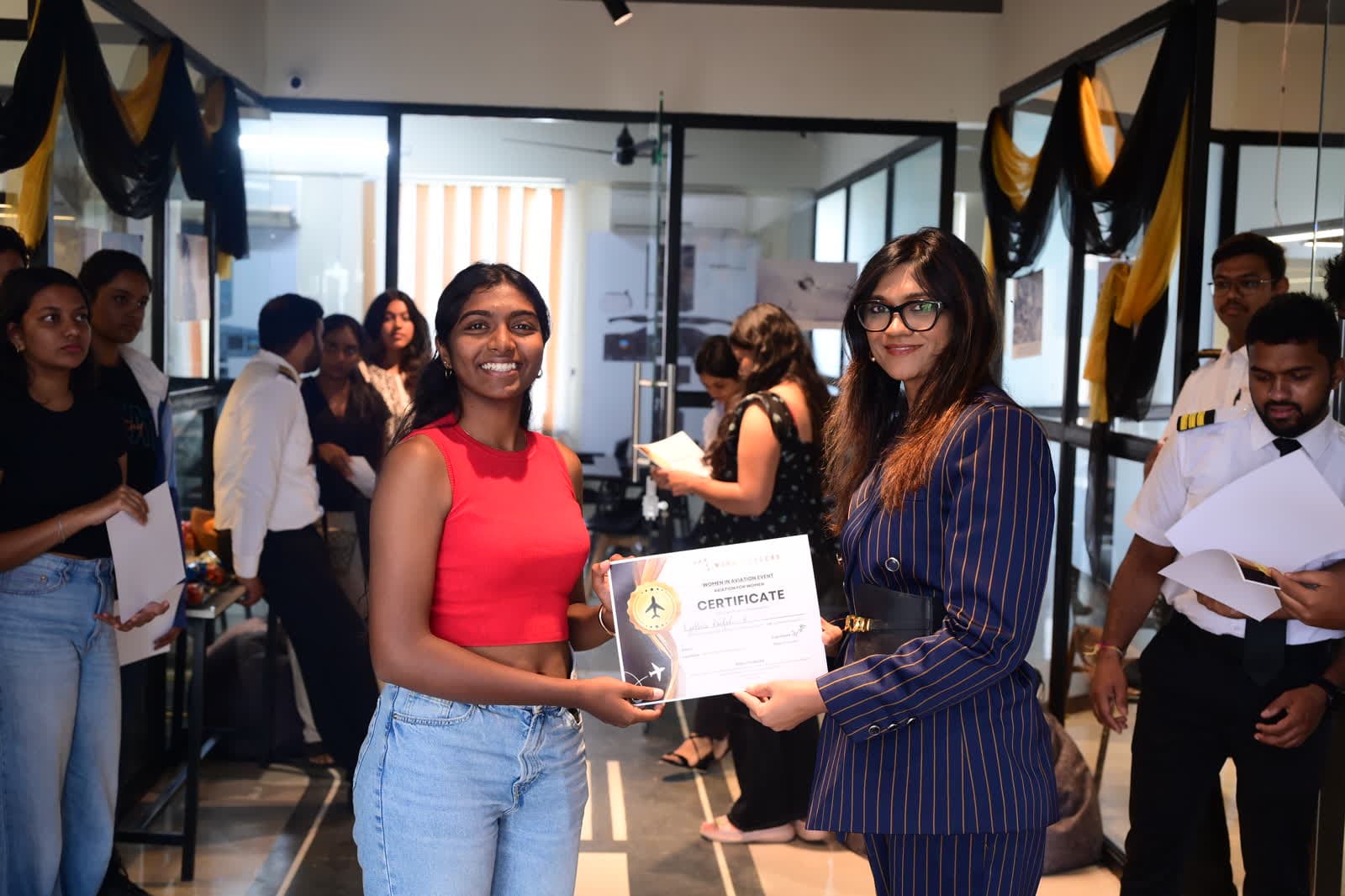An attendee receiving her participation certificate